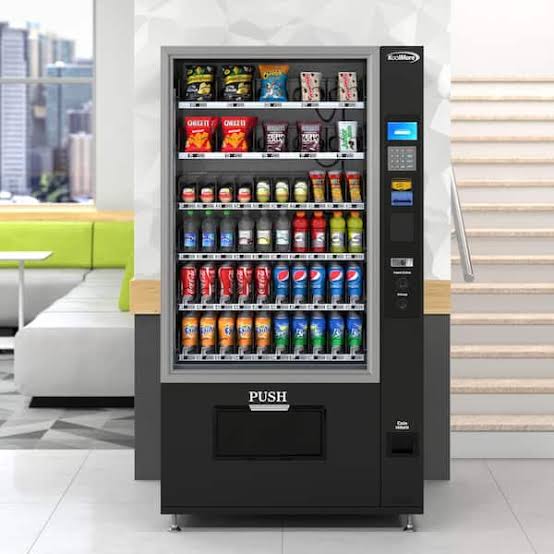 Modern combination snack and drink vending machine in an office lobby